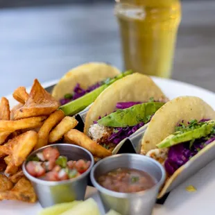 a plate of tacos and chips