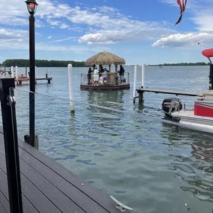 a dock with a boat and a flag