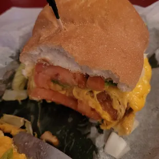 Chicken Sandwich with lettuce, tomato, and onion.