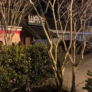 the outside of a restaurant at night