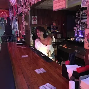 a woman behind the bar