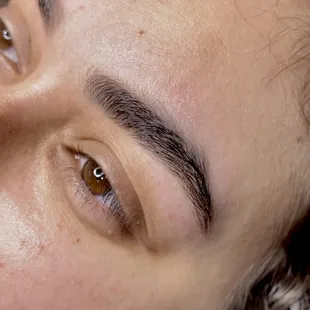 Brow Wax. Shaping the top, bottoms, and sides of the brows and trimming the brow hairs.