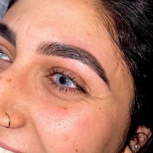 Eyebrow wax, tint, and shaping.