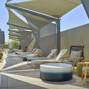 Shade sail pool dining available for rent on ResortPass or through the restaurant