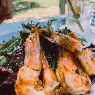 a plate of shrimp and salad