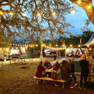 people sitting at a picnic table