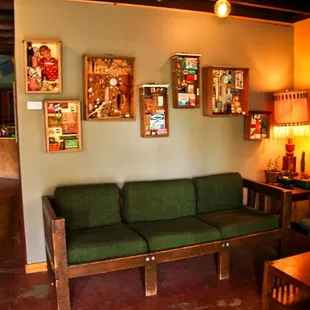 a living room with a green couch