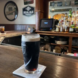 a pint of beer on the bar
