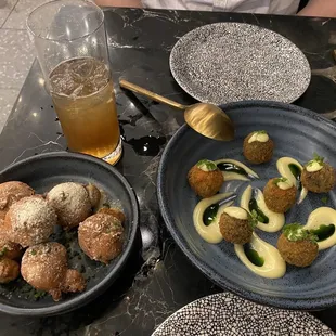 Corn beignets on the left, escargots croquettes on the right