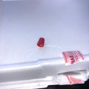 a piece of paper taped to a box