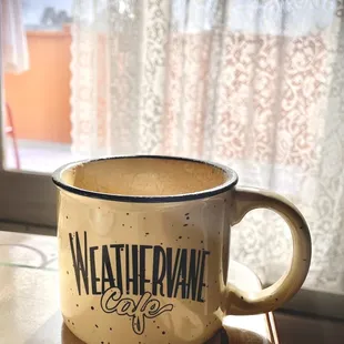 a cup of coffee on a table