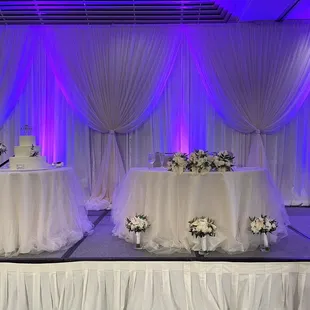 Pipe &amp; drape with bunch accents. Ivory matte satin linens and ivory tulle overlay. Another fave!