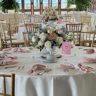 Gold chivari chairs &amp; blush matte satin napkins.