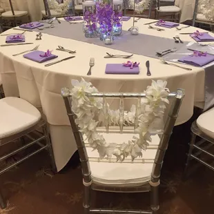 Silver chivari chairs, lavender satin runners &amp; lavender poly napkins