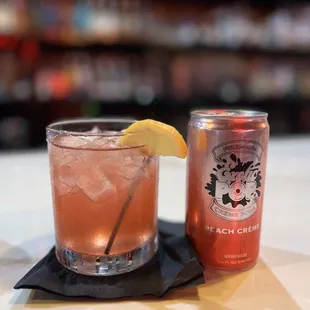 a drink and a can on a table