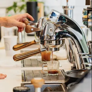 a bari serving a cup of coffee