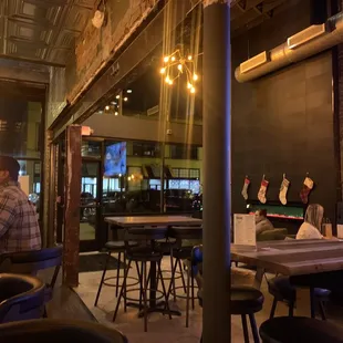 a man sitting at a table in a restaurant