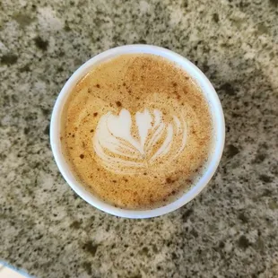 a cup of coffee on a table
