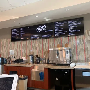 a coffee shop with menus on the wall