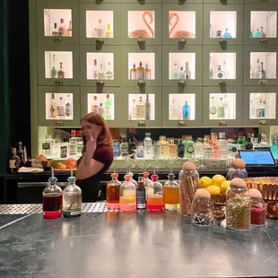 a woman behind a bar counter