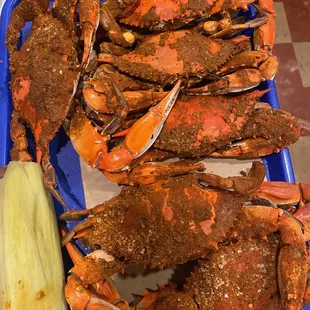 6 large crabs a' la carte with a side of corn