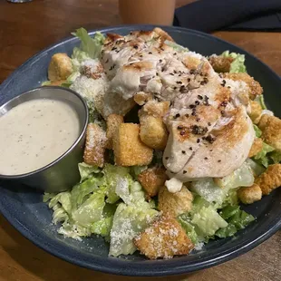 Chicken Caesar salad. Chicken is added cost.