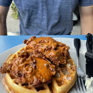 Fried chicken and waffle with Pterodactyl hot sauce, honey butter and cinnamon whiskey syrup