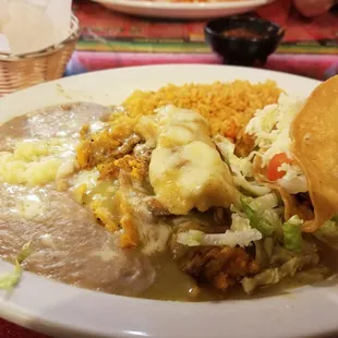 The Wet Burrito:  Combo #10C:  Pork tamal and hard taco.  Wet with green sauce.