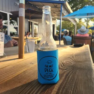 a bottle of beer on a wooden table