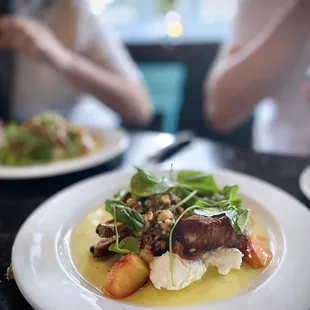 Jack Mountain Pork Chop | fresh sheep&apos;s milk cheese, charred stone fruit, hazelnut relish