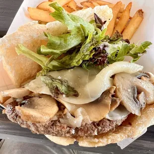 a sandwich and french fries on a picnic table