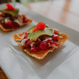 two appetizers on a white plate