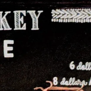 a sign for whiskey of the day
