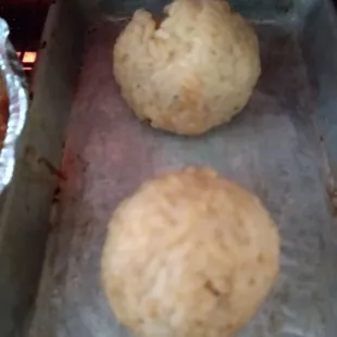 a pan of doughnuts cooking in the oven