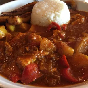 South African red curry and vegetables with jasmine rice and fried plantains.