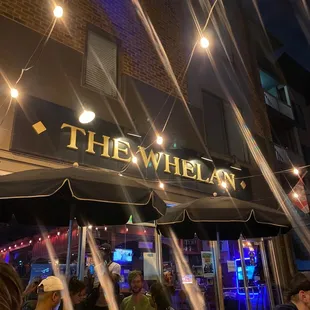 people sitting outside a restaurant