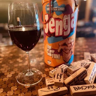 a glass of wine next to a bottle of beer