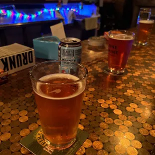 a pint of beer on a bar