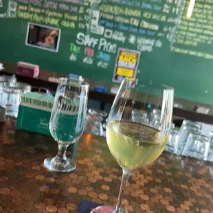 two glasses of wine on a table
