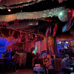 a group of people sitting in a bar