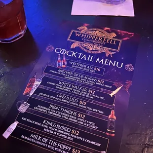 a cocktail menu on a table