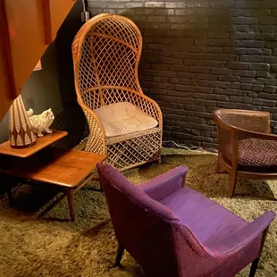 a living room with a purple chair
