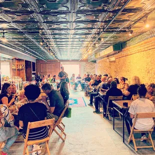 a large group of people sitting at tables