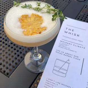 a drink with a leaf on it