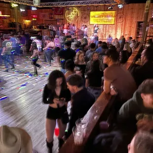 People standing on the dance floor.