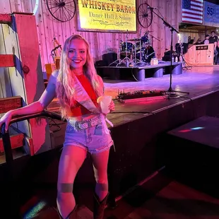 a woman in a cowboy outfit