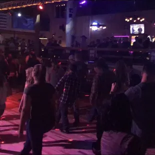 a large group of people dancing