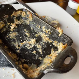 a baking dish on a cutting board