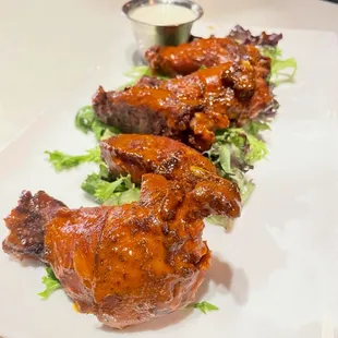 Chicken wings in a house made whiskey BBQ sauce