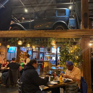 people sitting at tables in a restaurant